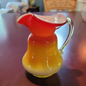 Nicely handblown small artglass pitcher...sunburst color!!