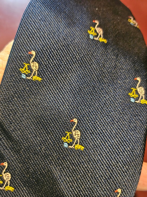Nice tie!  gorgeous navy with a flamingo and crest