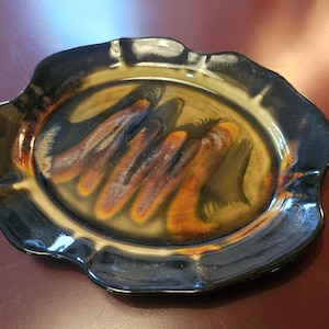 Beautifully done Pottery Plate by Edgecomb Potters...deep colors, shiny and lovely shape!  80s?