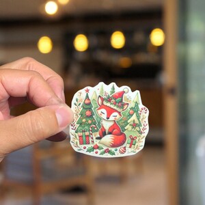 Christmas Fox Sticker - Festive Hat, Trees & Gifts bottle of water Cheerful Holiday Art vinyl sticker Holiday animal Sticker w3himsical fox