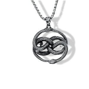 May include: Silver necklace with a pendant depicting two intertwined snakes in a circular arrangement. The snakes have textured scales and detailed heads. The chain is a box link style, and the pendant hangs from a decorative bail.