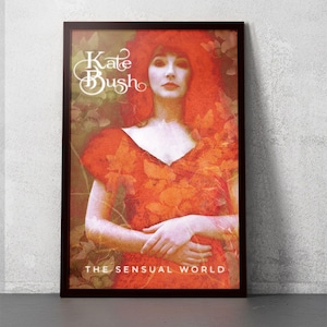 May include: A vintage-style poster featuring a woman with red hair wearing a red dress with floral patterns. The text "Kate Bush" and "The Sensual World" are printed on the poster.