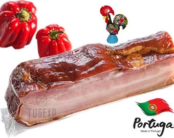 May include: A close-up of a vacuum-sealed package of smoked pork belly. The package is labeled "TUGEXP" and has a red and green Portuguese flag with the word "Portugal" printed below it. The flag is on a white background.