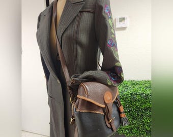 Dooney & Bourke Teton vintage RARE Drawstring saddle tasseled Pebbled crossbody.