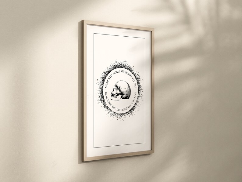 May include: Black and white print of a skull with the text "Memento Mori | Memento Vivere - To Remember You Die | Remember To Live" in a circle around it.