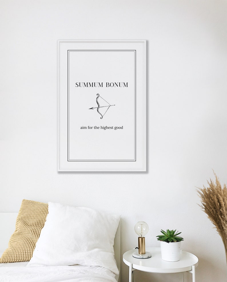 May include: A black and white print with the text "SUMMUM BONUM" and an illustration of an arrow and bow. The text below the illustration reads "aim for the highest good".