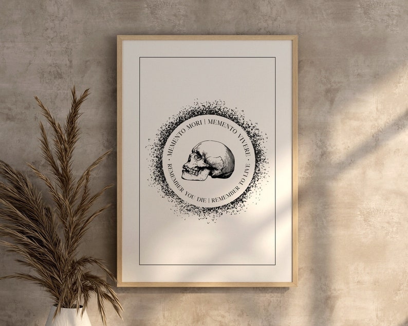 May include: Black and white print of a skull with the text "Memento Mori | Memento Vivere. Remember You Die | Remember To Live." in a circle around it.