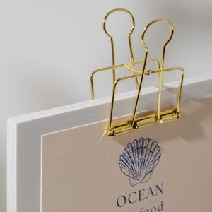 Handcrafted wooden menu board with a binder clip, great for displaying personalized menus at weddings, cafés, or cocktail bars.