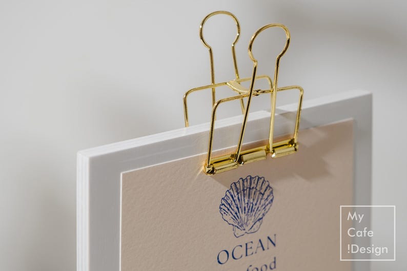 Handcrafted wooden menu board with a binder clip, great for displaying personalized menus at weddings, cafés, or cocktail bars.
