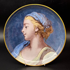 vintage wall plate of young farm hand girl in head scarf signed