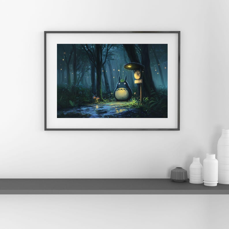 May include: Framed art print depicting a whimsical forest scene. A large, round, gray creature with a white belly stands near a signpost. The artwork features a dark, misty forest with glowing lights and a small stream.