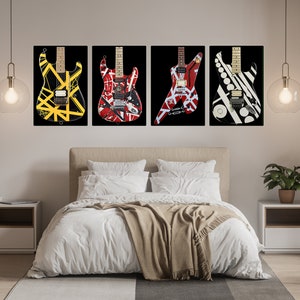 May include: Four framed guitar art prints with black backgrounds. The guitars feature bold designs in yellow, red, white, and black. The prints hang above a bed with white bedding and a tan throw blanket. A small plant sits on a nightstand.