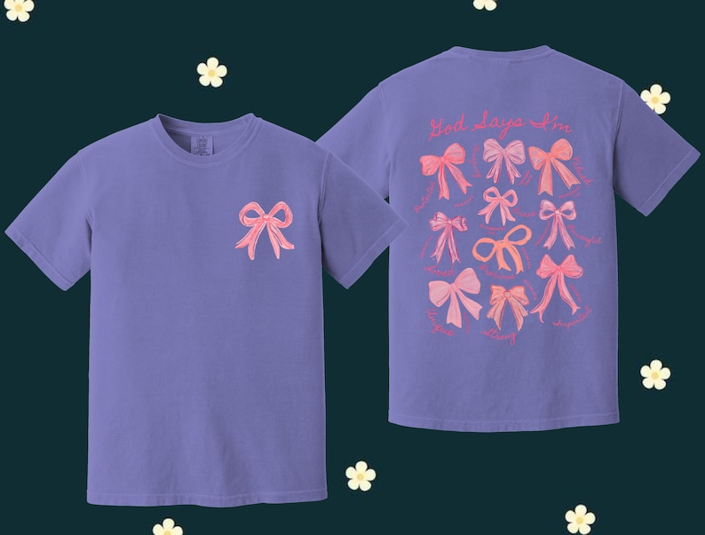 May include: Two purple t-shirts with pink bows printed on them. The front shirt has one bow and the back shirt has multiple bows with the text "Hot days are in" printed above them.