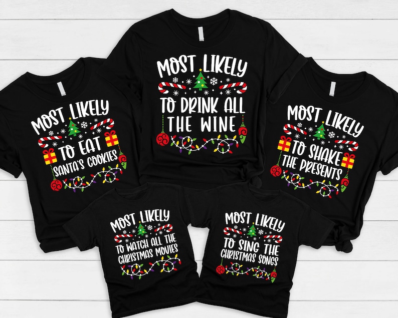 May include: Five black t-shirts with white text and Christmas-themed graphics. The shirts read "Most Likely to Eat Santa's Cookies", "Most Likely to Drink All the Wine", "Most Likely to Shake the Presents", "Most Likely to Watch All the Christmas Movies", and "Most Likely to Sing the Christmas Songs".