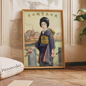 May include: A vintage poster featuring a woman in a traditional Japanese kimono standing in front of a cityscape. The poster is framed in gold and has the text "日本 大 綱 汽 " in Japanese.