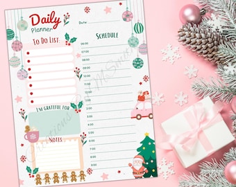May include: A printable daily planner with a Christmas theme. The planner has a to-do list, a schedule, a section for notes, and a section for things you are grateful for. The planner is decorated with Christmas ornaments, gingerbread men, a Christmas tree, and Santa Claus.