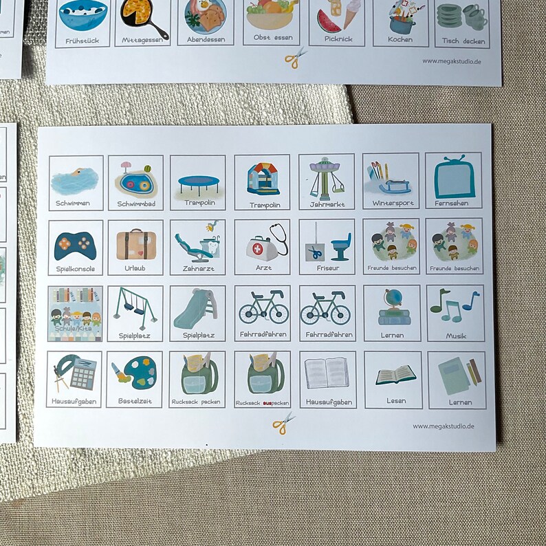 May include: A visual schedule with colorful illustrations of activities for children. The schedule includes activities like swimming, playing on a playground, riding a bike, and learning. The text on the schedule includes words like "Schwimmen", "Spielplatz", "Fahrradfahren", and "Lernen".