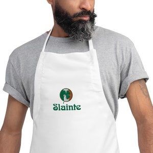 May include: White apron with a green shamrock and the word "Slainte" embroidered on it.