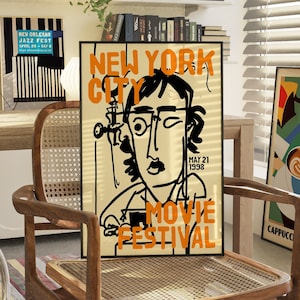 May include: A black and white illustration of a person wearing glasses on a poster that says "New York City Movie Festival" with the date "May 21, 1998".