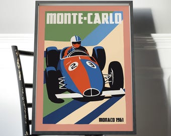 May include: A framed poster featuring a vintage race car with the number 23, colored in blue and orange. The text reads MONTE-CARLO at the top and MONACO 1961 at the bottom. The background consists of green, blue, and cream geometric shapes.