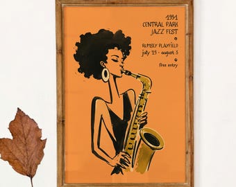 May include: A framed poster featuring a stylized illustration of a person with dark hair playing a saxophone against an orange background. The text reads 1991 CENTRAL PARK JAZZ FEST, RUMSEY PLAYFIELD, july 29 - august 5, and free entry.