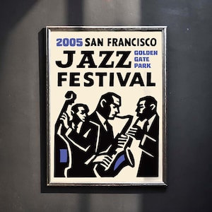 May include: Framed poster for the 2005 San Francisco Jazz Festival. The poster features a black and white illustration of three musicians playing instruments, with blue accents. The text includes "JAZZ FESTIVAL" and "Golden Gate Park."
