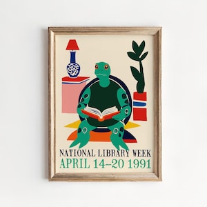 May include: A framed art print featuring a green turtle reading a book, with the text "NATIONAL LIBRARY WEEK APRIL 14-20 1991". The illustration includes a lamp, vase, and potted plant, all in a colorful, retro style.