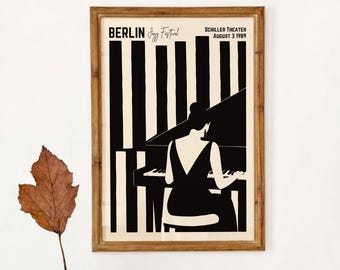 May include: A framed poster featuring a black and white illustration of a person playing a grand piano. The text reads BERLIN Jazz Festival, SCHILLER THEATER, AUGUST 3 1989. The background consists of vertical black and white stripes.