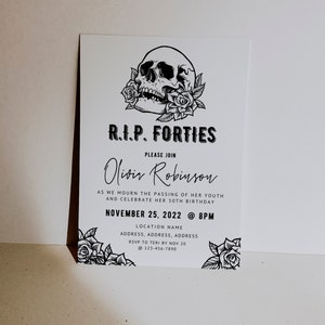 May include: A white invitation card with black text and graphics. The card features a skull with roses, the text "R.I.P. FORTIES," and event details for a 50th birthday celebration on November 25, 2022.