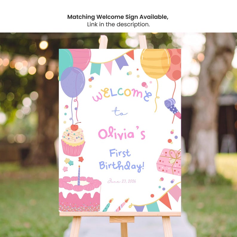 May include: A vibrant birthday welcome sign on a wooden easel. The sign says "Welcome to Olivia's First Birthday!" with illustrations of balloons, a cupcake, a cake, and a gift. The date June 23, 2026 is shown.