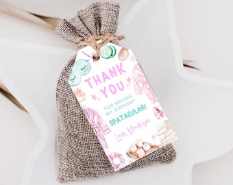May include: A small burlap bag tied with twine, holding a gift. A white tag with watercolor illustrations and text that reads "Thank You" and "For making my birthday SPATACULARI! Love, Madison."