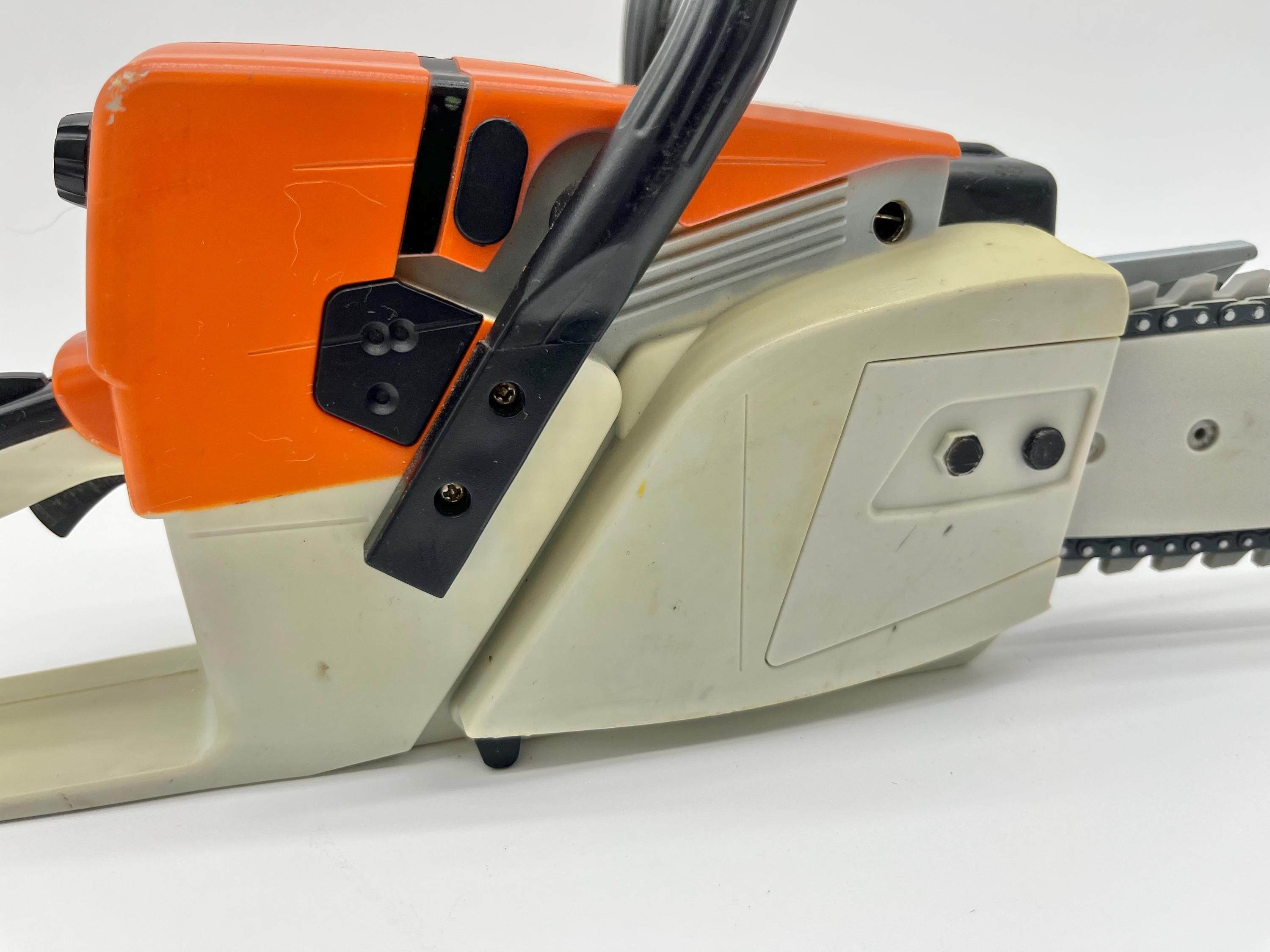 STIHL Brand Kids Toy Chainsaw With Rotating Chain and Sounds
