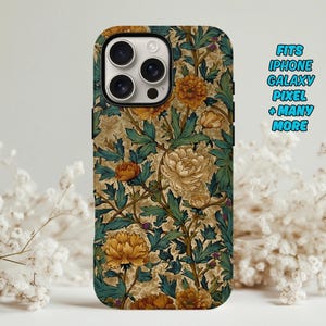 May include: A phone case with a floral pattern featuring yellow and cream-colored flowers and green leaves on a tan background. The case has a black border and the text "FITS IPHONE GALAXY PIXEL + MANY MORE" in blue.