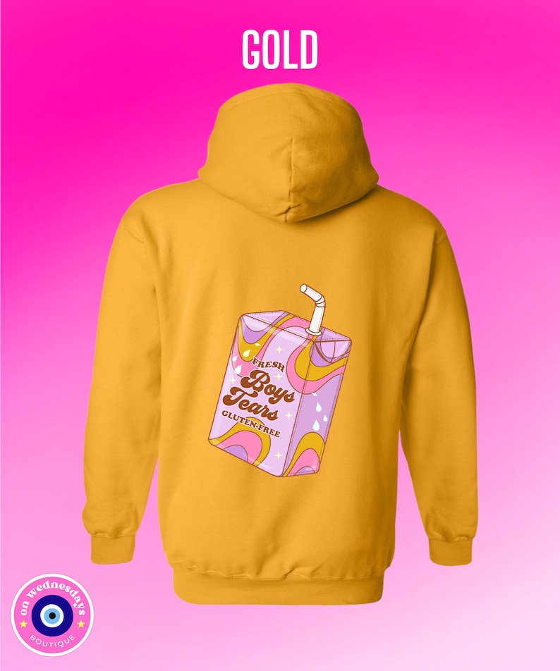 May include: A gold hoodie with a cartoon illustration of a juice box with the text "Fresh Boys Tears Gluten-Free" on the back.