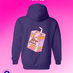 May include: Purple hoodie with a graphic of a cartoon juice box that says "Fresh Boys Tears Gluten-Free" on it.