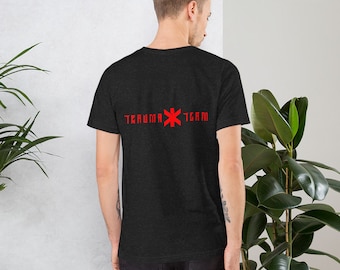 May include: A black t-shirt with a red medical symbol and the text "Trauma Team" printed on the back.