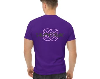 May include: A purple t-shirt featuring a geometric design and the word "HURRAX" on the back. The design is a combination of pink and green. The shirt is made of a soft, comfortable material.
