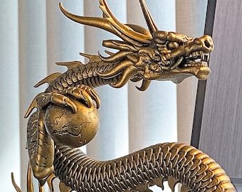 Statue of Chinese Dragon (a.k.a. Lung, Long, 龙, 龍 or Loong) holding the Earth, important Feng Shui symbol for protection and prosperity.