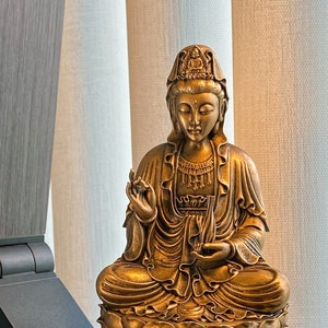 Statue of Kwan Yin, a.k.a. Bodhisattva of Compassion, Goddess of Mercy, Avalokiteshvara, Guanyin, Kuan Eim, Kwun Yum, Kanzeon, Gwan-eum