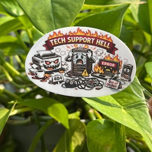 May include: An oval sticker featuring a cartoon illustration with the text TECH SUPPORT HELL. The design includes a demonic printer, a stressed computer tower, a burning laptop with an ERROR screen, a smartphone, and signs reading 404 and Out of Order.