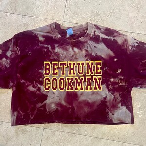 BETHUNE COOKMAN garnet bleach crop tee with gold and  maroon letters.