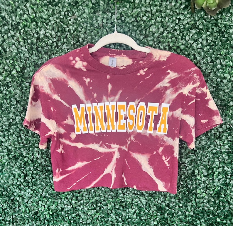 Maroon bleach crop tee for MINNESOTA with white and gold letters.
