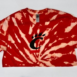 Cincinnati Bearcats in a red bleach crop tee with logo in black.