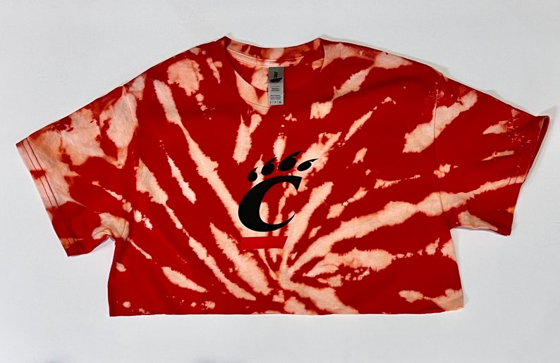 Cincinnati Bearcats in a red bleach crop tee with logo in black.