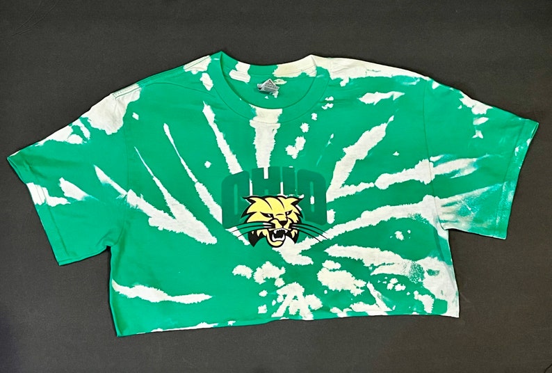 Ohio University in a green bleach tie dye crop tee with logo