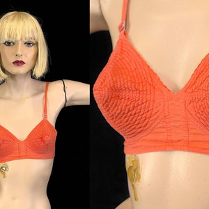 Vintage 50s 60s coral bullet bra with circle stitch