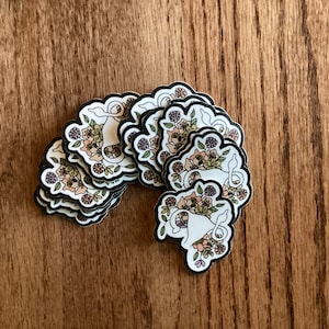 Uterus Sticker with ovary giving the finger and surrounded by flowers - 2 inch die-cut waterproof matte sticker