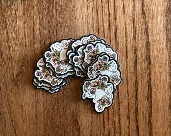 Uterus Sticker with ovary giving the finger and surrounded by flowers - 2 inch die-cut waterproof matte sticker