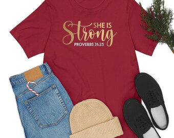 She is Strong Proverbs 31:25 - Christian Scripture Virtuous - Adult Women Unisex Jersey Short Sleeve Tee