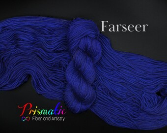 May include: A skein of deep blue yarn called "Farseer" by Prismatic Fiber and Artistry.